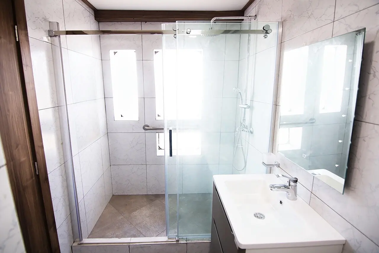 En-suite private bathroom with shower inside a Tiburon Explorer cabin