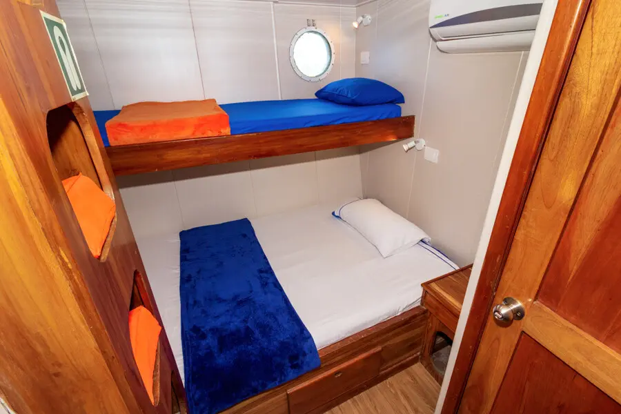 Single bed setup inside a passenger cabin on the Danubio Azul