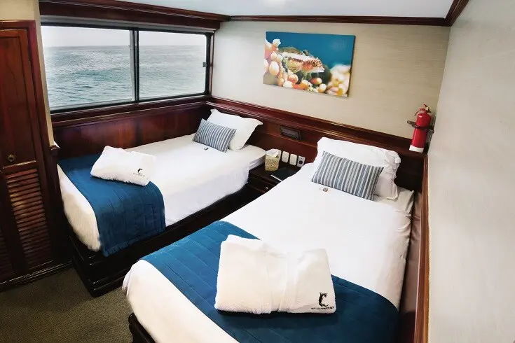 Twin beds in a Galapagos Sky cabin