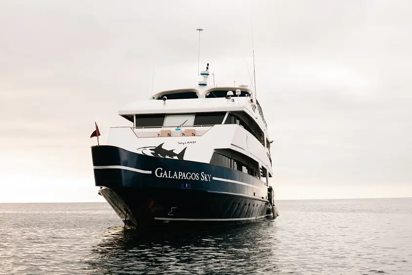 Diver entering the water from the Galapagos Sky