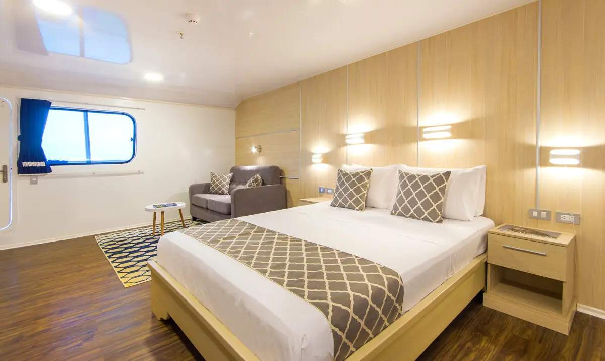 Twin beds in an upper deck suite on the Solaris